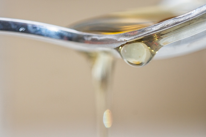 Honey dripping of a spoon