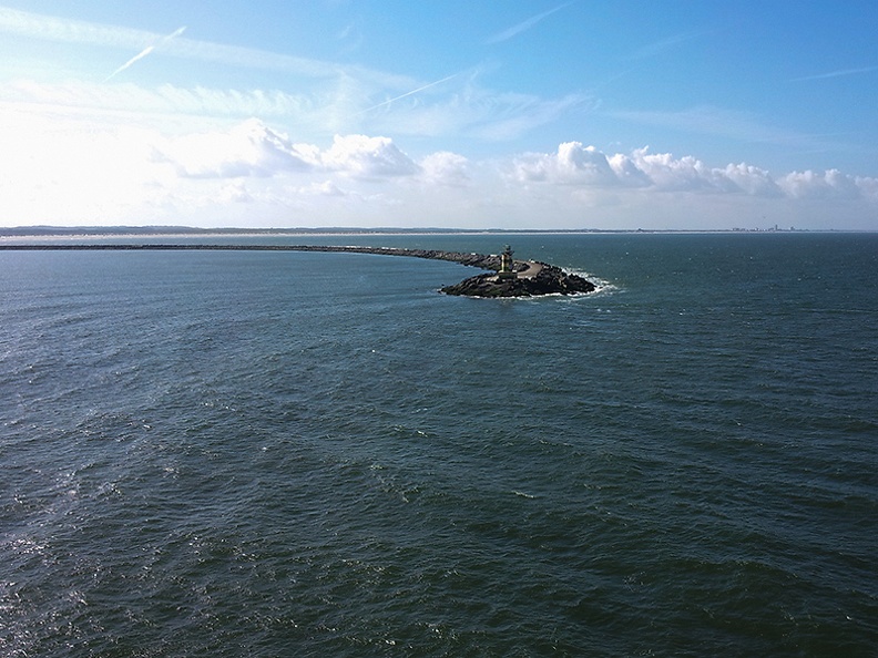 Returning from vacation. Harbor of IJmuiden with Zandvoort in the background.