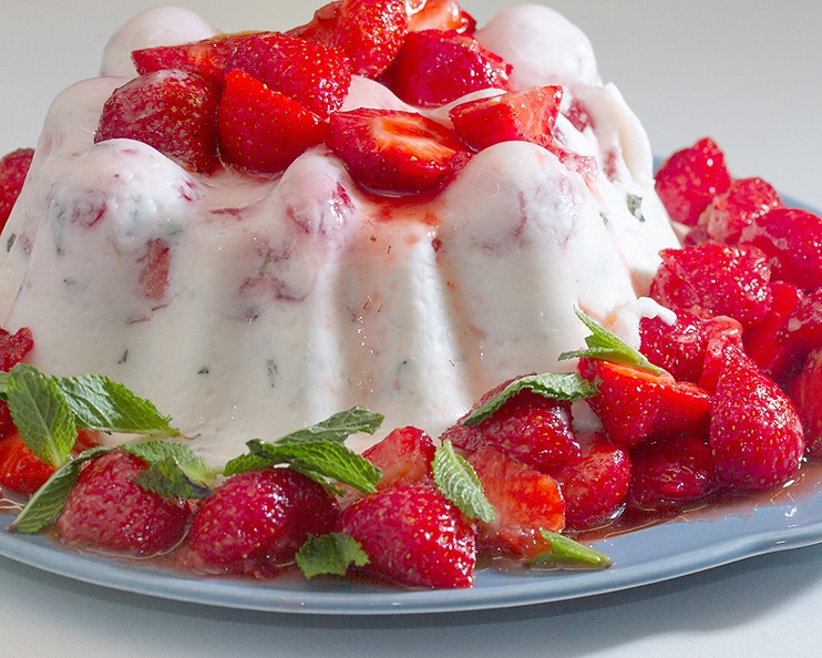 With strawberries and mint (and jelly, lots of whipped cream and sugar)