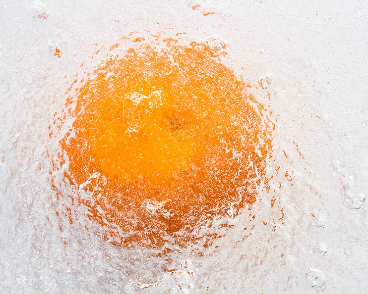 Mandarin behind ice (in my garden)
