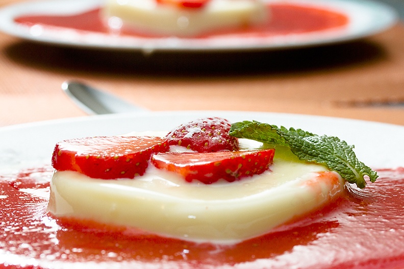 A nice home made panna cotta with fresh strawberry sauce.