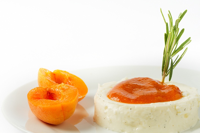 Panna cotta with an apricot-rosemary sauce.
