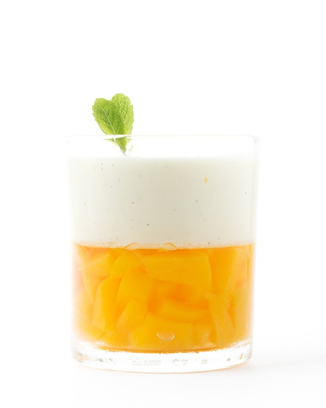 Peach jelly with panna cotta on top.