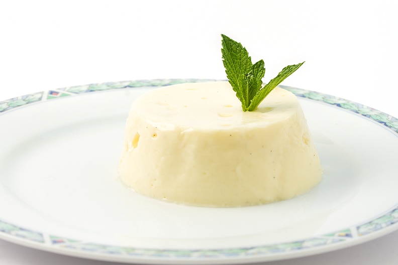 Made a simple dessert (yesterday) for today.  Panna cotta with lemon curd and some mint for the decoration.