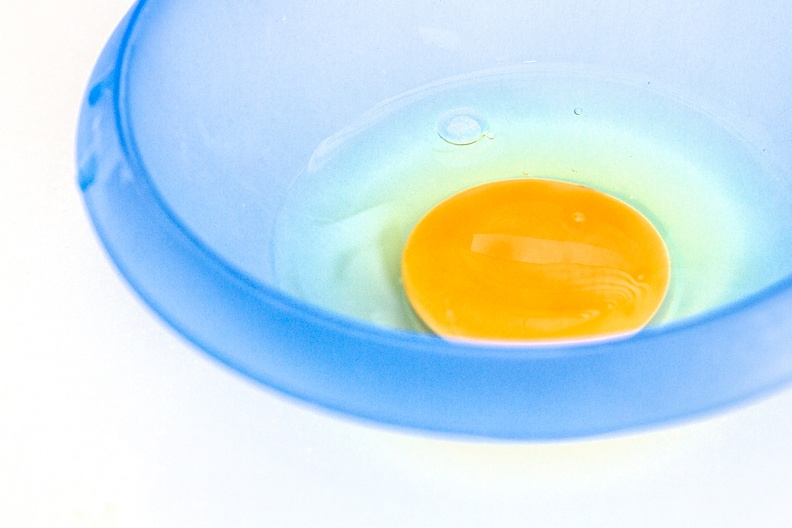 Egg in a blue bowl. Prelude to a nice meal
