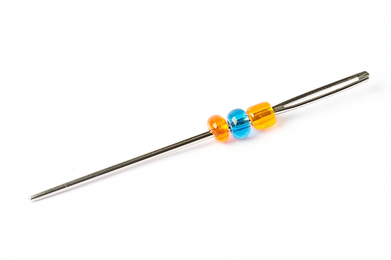 Small beads on a needle