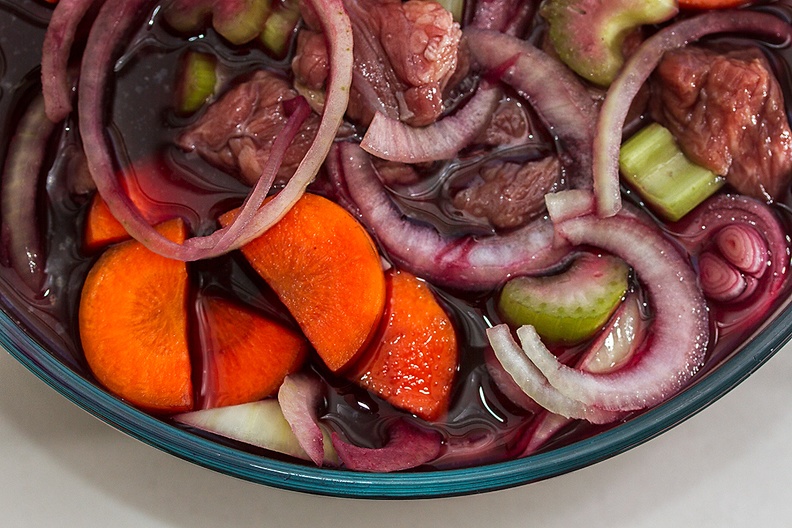 Vegetables and meat in wine. Prelude to a stew