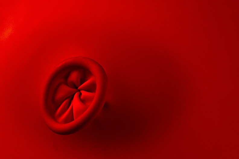 Detail of a red balloon. It was under the cap of yesterday