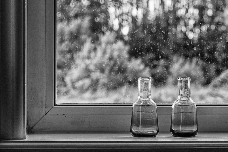 Two vases in a window
