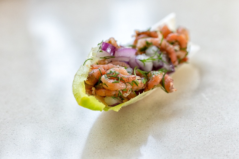 The appetizer I made today. Chicory with a sauce on the bottom, shrimps, red onions and dill on top.