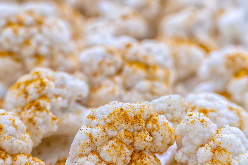Cauliflower with curry powder, almost ready to be roasted in the oven