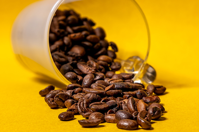 Coffee beans and a glass