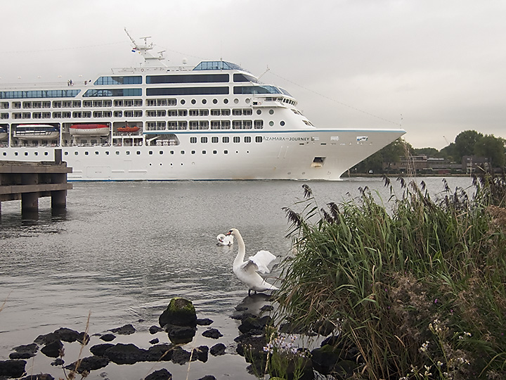 Another cruise ship on the canal on a cloudy morning.